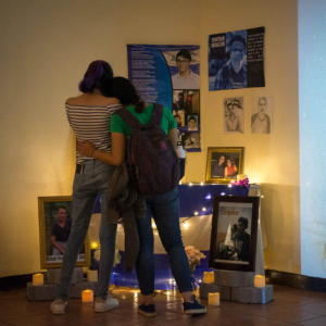 A photo of visitors at the collective altar in the exhibition of the Museum at the Institute of History of Nicaragua and Central America.