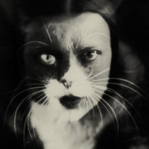 black and white photograph of woman with cat face