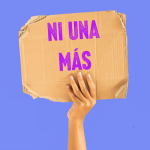 Ni Uns Más written on a cardboard sign.