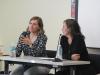 photograph of Beth Tarini and Jennifer Reich at table