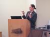 photo of Sarah Heinz speaking at lectern in Lane Hall